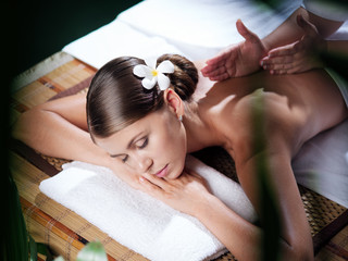 portrait of young beautiful woman in spa environment.  