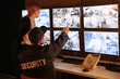 © Africa Studio - Security guards working in surveillance room