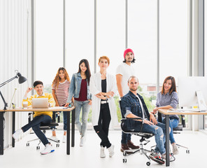 Wall Mural - Confident group portrait of multiethnic diverse business team in office meeting, copy space. Creative people, organization team building, mission vision, solution support service, or startup concept