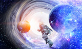 Fototapeta Kosmos - Running spaceman and galaxy. Mixed media