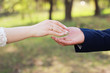 © dyageleva - happy couple. Hands of a guy and a girl.Walk by the hand