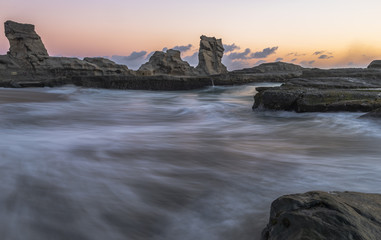 Wall Mural - Klayar beach in long exposure shot and golden hours, East Java, Indonesia; May 2018