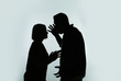 © New Africa - Silhouette of couple having argument on color background. Relationship problems