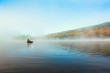Acive Senior Man Solo Kayaking in Morning