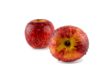 TWO DROP WATER RED STRIPED APPLES. ISOLATED AGAINST WHITE BACKGROUND