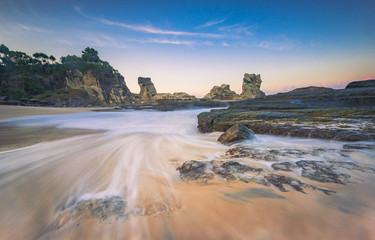 Wall Mural - Klayar beach in long exposure shot and golden hours, East Java, Indonesia; May 2018