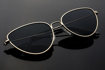 sunglasses cat's eye in metal frame isolated on black