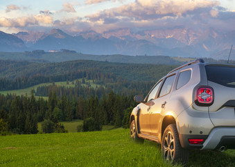 suv on a mountain meadow