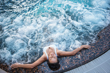 Top View Full Length Serene Girl Having Leisure While Situating In Swimming Pool. She Closing Eyes