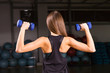 © satura_ - Attractive young sports woman with dumbbells