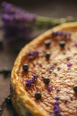 Wall Mural - blueberries and lavander cheesecake served on oven with berries and flowers, still life for patisserie, healthy cake