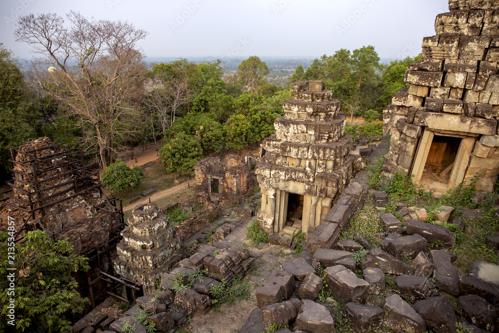 Ancient khmer temple view in Angkor Wat, Cambodia. Sunrise in Phnom Bakheng. Morning dew in Phnom Bakheng temple.