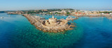 Fototapeta  - Aerial birds eye view drone photo of Rhodes city island, Dodecanese, Greece. Panorama with Mandraki port, lagoon and clear blue water. Famous tourist destination in South Europe