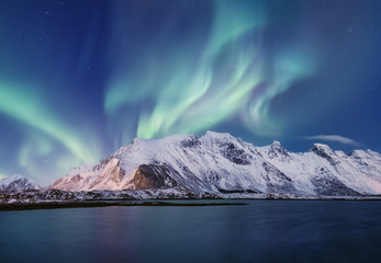 Northen light above mountains on the Lofoten islands. Beautiful natural landscape in the Norway