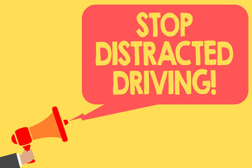 Wall Mural - Handwriting text Stop Distracted Driving. Concept meaning asking to be careful behind wheel drive slowly Man holding megaphone loudspeaker speech bubble message speaking loud.