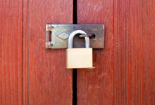 Locked Padlock With Chain At Wooden Door Background, Vintage, Closeup