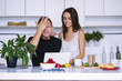 © mikitiger - cute young woman and man in white kitchen near table in house