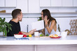 © mikitiger - cute young woman and man in white kitchen near table in house