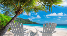 Beach Chairs On Sandy Beach With Palm And Turquoise Sea.  Summer Vacation And Travel Concept.  