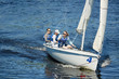 © pressmaster - Group of free yachtsmen in sunglasses and life jackets sitting on sailboat deck and contemplating around while sailing at competition