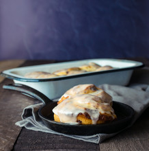 Cast Iron Pan With Fresh Baked Cinnamon Rolls With Icing