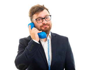 Wall Mural - Portrait of business man talking on blue receiver.