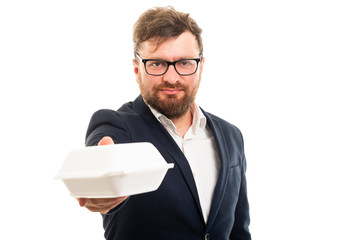Wall Mural - Portrait of business man offering to go lunch box.