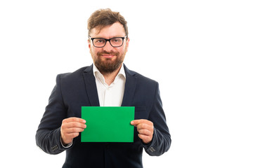 Wall Mural - Portrait of business man holding green card board.