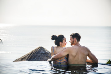 Couple relaxing in a swimming pool