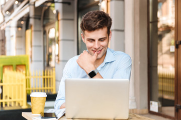 Poster - Happy young stylish man in shirt working