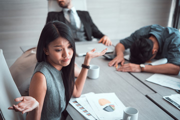 business woman and sleeping resting on workplace during work meeting. 