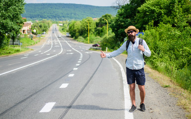 Wall Mural - Stop car. Man try stop car thumb up. Hitchhiking one of cheapest ways traveling. Picking up hitchhikers. Hitchhikers risk being picked up by someone who is unsafe driver or personally dangerous