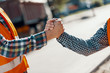 © Photographee.eu - Close-up of two workers giving a handshake