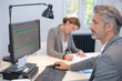 © auremar - mature businessman working on computer in office