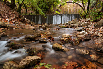 Paleokarya, old, stone, arched bridge, between two waterfalls. Trikala prefecture, Thessaly, Greece