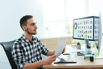 Leinwandbilder - Web Designer Working On Design Project In Office.