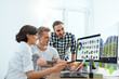 © puhhha - Web Design. Team Of Designers Working On Computer In Office