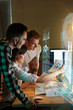 © puhhha - Programmers Working On Software In Office