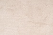 © Chinnapong - Carpet floor mat or beach towel texture background in beige color made of wool or synthetic fibers, polypropylene, nylon or polyester material