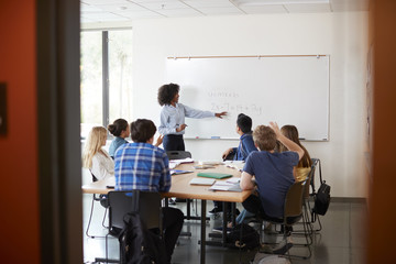 Wall Mural - View Through Doorway Of High School Tutor At Whiteboard Teaching Maths Class