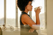© Jacob Lund - Businesswoman having a coffee break