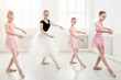 © Prostock-studio - Teacher helping her students during dance class
