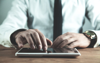 Man using white digital tablet. Business concept