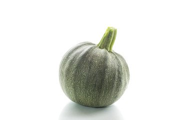 round zucchini on white background