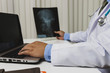 © skarie - Doctor diagnose and analyze on x-ray film of patient.