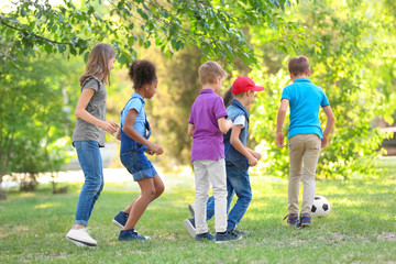 Sticker - Cute little children playing with ball outdoors on sunny day