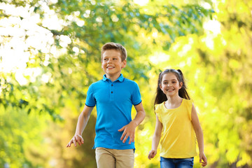 Sticker - Cute little children playing together outdoors on sunny day