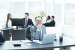 © yurolaitsalbert - portrait of adult businessman at the Desk in the office