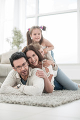 cheerful family relaxes in the living room