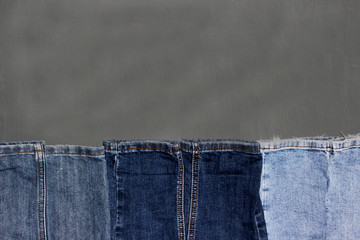 Denim frame on  grey background, space for text